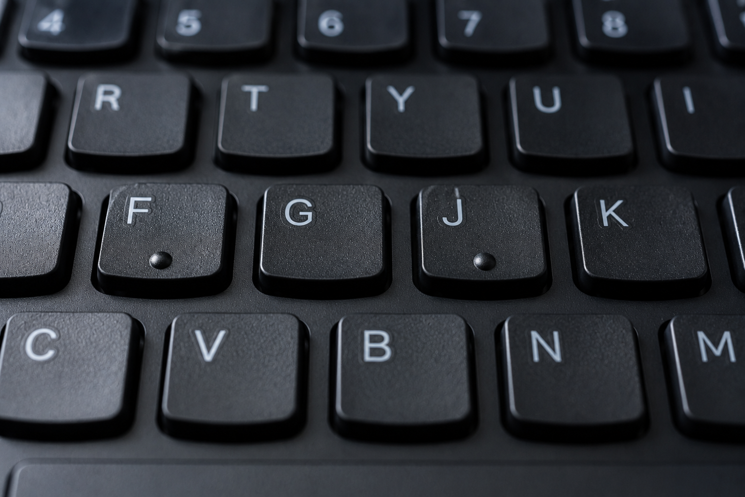 Those Tiny Bumps on the F and J Keys Have a Secret Purpose: Why Your Keyboard Helps You Type Without Looking